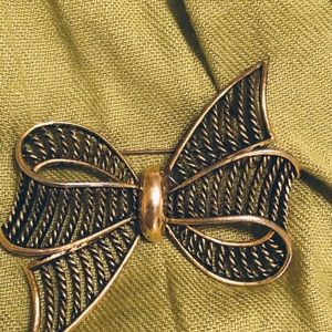 Vintage gold tone and black pin